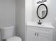 Bathroom with modern vanity, stylish mirror, and toilet at 7015 Setters Way, Lithonia, GA 30038