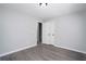 Bedroom with neutral walls, a closet, and wood-look flooring at 7015 Setters Way, Lithonia, GA 30038
