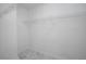 Walk-in closet with white wire shelving and stylish gray and white tile flooring at 7015 Setters Way, Lithonia, GA 30038