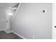 Entryway leading to stairway featuring modern gray wall and thermostat at 7015 Setters Way, Lithonia, GA 30038