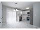 Bright kitchen with white cabinets, stainless steel appliances, and sleek gray countertops at 7015 Setters Way, Lithonia, GA 30038