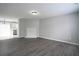 Living room with wood floors, decorative fireplace, and open floor plan at 7015 Setters Way, Lithonia, GA 30038