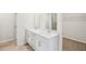 Double vanity bathroom with a walk-in shower at 1569 High Falls Ln, Grayson, GA 30017