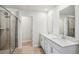 Bathroom with double vanity and walk-in shower at 1569 High Falls Ln, Grayson, GA 30017