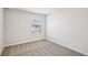Spacious bedroom with neutral carpeting and window at 1569 High Falls Ln, Grayson, GA 30017