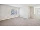 Bright bedroom with two windows and carpet at 1569 High Falls Ln, Grayson, GA 30017