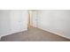 Simple bedroom with neutral walls and carpet at 1569 High Falls Ln, Grayson, GA 30017
