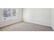 Bright bedroom with neutral carpeting and large windows at 1569 High Falls Ln, Grayson, GA 30017