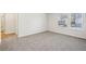 Spacious bedroom with carpet and access to bathroom at 1569 High Falls Ln, Grayson, GA 30017