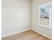 Simple bedroom with hardwood flooring and window at 1569 High Falls Ln, Grayson, GA 30017