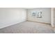 Bright bedroom with neutral walls and carpet at 1569 High Falls Ln, Grayson, GA 30017