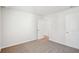 Bedroom with carpet, neutral walls and two doors at 1569 High Falls Ln, Grayson, GA 30017