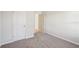 Well-lit bedroom with neutral wall paint and carpet at 1569 High Falls Ln, Grayson, GA 30017