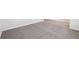Spacious bedroom with neutral carpeting and hardwood flooring at 1569 High Falls Ln, Grayson, GA 30017
