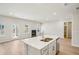 Open concept kitchen and Gathering room with a view of the backyard at 1569 High Falls Ln, Grayson, GA 30017