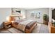 Main bedroom with king bed and large windows at 1569 High Falls Ln, Grayson, GA 30017