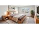 Main bedroom with king bed and large windows at 1569 High Falls Ln, Grayson, GA 30017