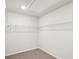 Spacious walk-in closet with wire shelving at 1569 High Falls Ln, Grayson, GA 30017