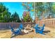 Charming backyard with fire pit and Adirondack chairs provides a cozy outdoor gathering space at 37 Highcrest Dr, Acworth, GA 30101