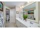 Bathroom showcasing double sinks, a large mirror, and adjacent toilet room, combining style and functionality for everyday use at 37 Highcrest Dr, Acworth, GA 30101