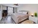 Bright bedroom with a ceiling fan, gray-washed floors, a comfortable bed, and a cozy rug, creating a relaxing atmosphere at 37 Highcrest Dr, Acworth, GA 30101