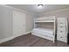 Bedroom featuring a bunk bed with drawers and a door, offering a cozy and functional space at 37 Highcrest Dr, Acworth, GA 30101
