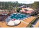 Stunning aerial view of the covered community pool area with mushroom water feature and meticulously maintained landscaping at 37 Highcrest Dr, Acworth, GA 30101