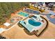 Aerial view of a community pool with covered play area, playground, and basketball court at 37 Highcrest Dr, Acworth, GA 30101