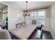 Elegant dining room featuring a large table, hardwood floors, and plenty of natural light from the windows at 37 Highcrest Dr, Acworth, GA 30101