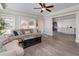 Bright living room with ceiling fan has ample seating and is perfect for relaxing or entertaining at 37 Highcrest Dr, Acworth, GA 30101