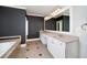 Elegant bathroom with dual sinks, granite countertops, and tiled floors provides a modern touch at 37 Highcrest Dr, Acworth, GA 30101