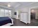 Spacious main bedroom boasts a tray ceiling, large window, and walk-in closet for ample storage at 37 Highcrest Dr, Acworth, GA 30101