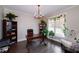 Bright home office featuring a dark desk, bookshelves, hardwood floors and natural lighting at 37 Highcrest Dr, Acworth, GA 30101