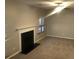 Spacious living room featuring a fireplace, neutral walls, and carpeted floors at 5332 Shirewick Dr, Lithonia, GA 30058