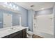 A full bathroom with a shower and bathtub combo and a vanity with a white countertop at 2056 Wildflower Way, Conyers, GA 30012