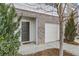 Front exterior shows the house number and a single-car garage at 2056 Wildflower Way, Conyers, GA 30012