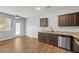A modern kitchen with stainless steel appliances, granite countertops, and ample storage space at 2056 Wildflower Way, Conyers, GA 30012