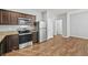 Modern kitchen with stainless steel appliances, granite countertops, and ample cabinet space at 2056 Wildflower Way, Conyers, GA 30012