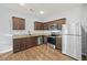 Modern kitchen with stainless steel appliances, granite countertops, and ample cabinet space at 2056 Wildflower Way, Conyers, GA 30012