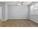 Bright living room with wood floors, large windows, and an open layout at 2056 Wildflower Way, Conyers, GA 30012