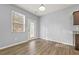 Bright living room featuring wood floors, and large windows at 2056 Wildflower Way, Conyers, GA 30012