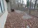View of a back deck with gray railings, furniture, and lots of leaves at 3321 Border Dr, Stone Mountain, GA 30087