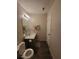 Bathroom featuring vanity, mirror, toilet and towel racks at 3321 Border Dr, Stone Mountain, GA 30087