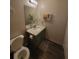 Half bath featuring toilet, vanity, and towel racks at 3321 Border Dr, Stone Mountain, GA 30087