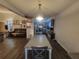 Inviting dining area leading into a living room, featuring updated floors at 3321 Border Dr, Stone Mountain, GA 30087