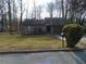 Charming single-story home featuring a well-maintained yard and an attached garage at 3321 Border Dr, Stone Mountain, GA 30087
