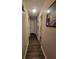 Hallway with wood floors and neutral colored walls at 3321 Border Dr, Stone Mountain, GA 30087