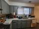 Well-lit kitchen featuring gray cabinets, quartz countertops, stainless steel appliances at 3321 Border Dr, Stone Mountain, GA 30087