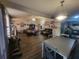 An open living room/dining area, featuring updated floors and ample space for entertaining at 3321 Border Dr, Stone Mountain, GA 30087
