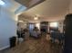 Living room with fireplace, ceiling fan, modern flooring, and adjacent dining area at 3321 Border Dr, Stone Mountain, GA 30087